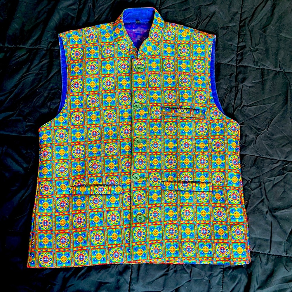 NEVER WORN. Boys blue and yellow colored vest